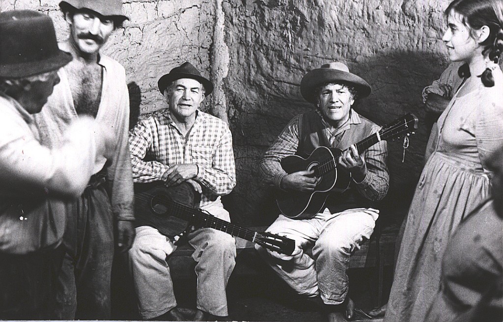 Um cenário rural representando a cultura caipira, com elementos de música sertaneja.