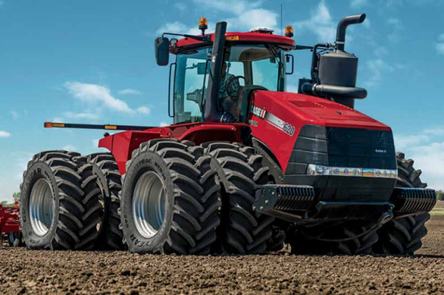 Maquinário agrícola moderno em um campo vasto, simbolizando o futuro da produção rural.