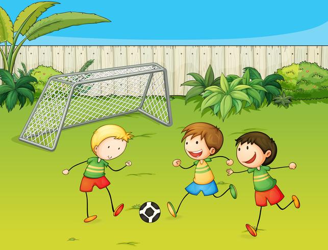 Crianças jogando futebol em um campo rural